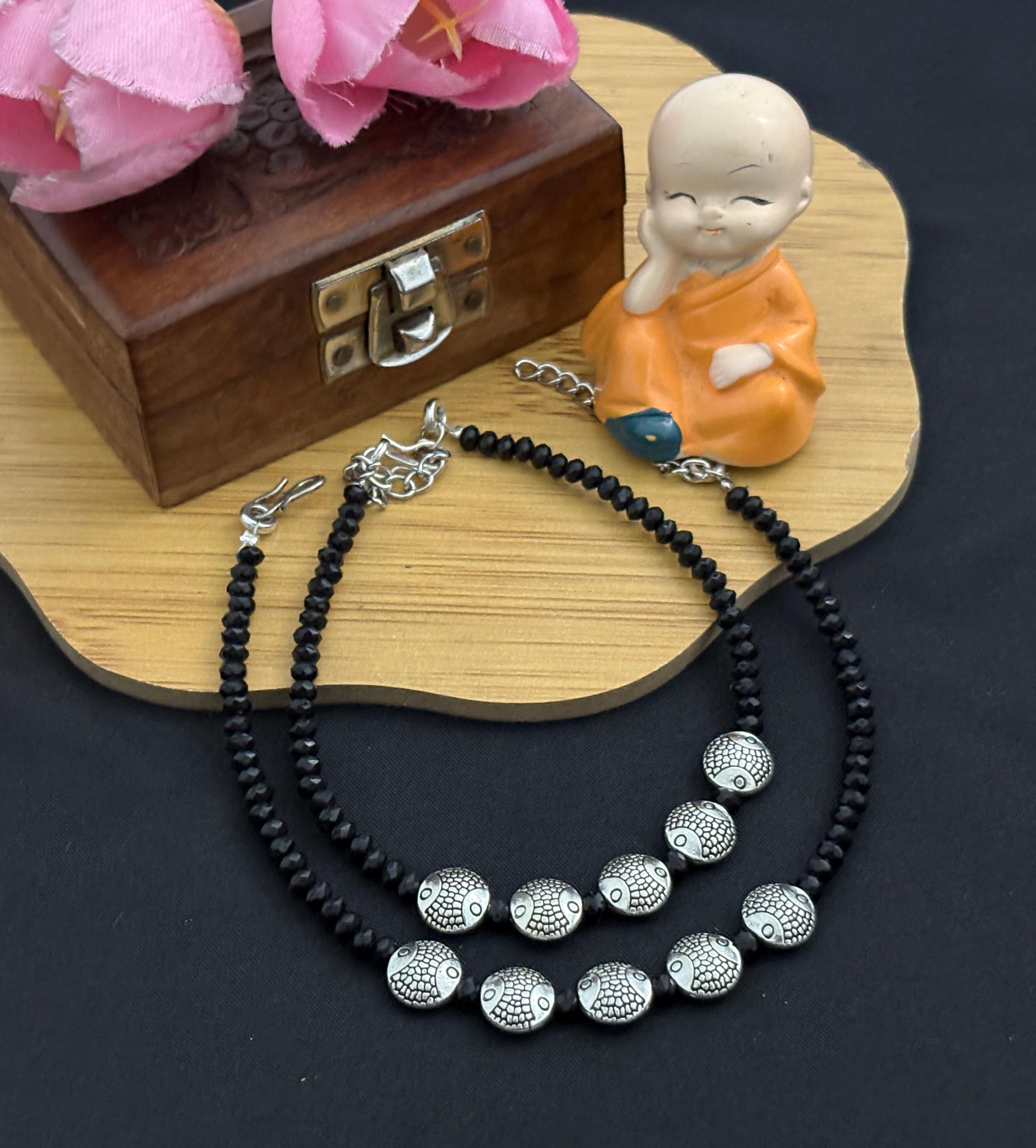 Charming Black Beaded Anklet with Silver Fish Motifs for Stylish Footwear