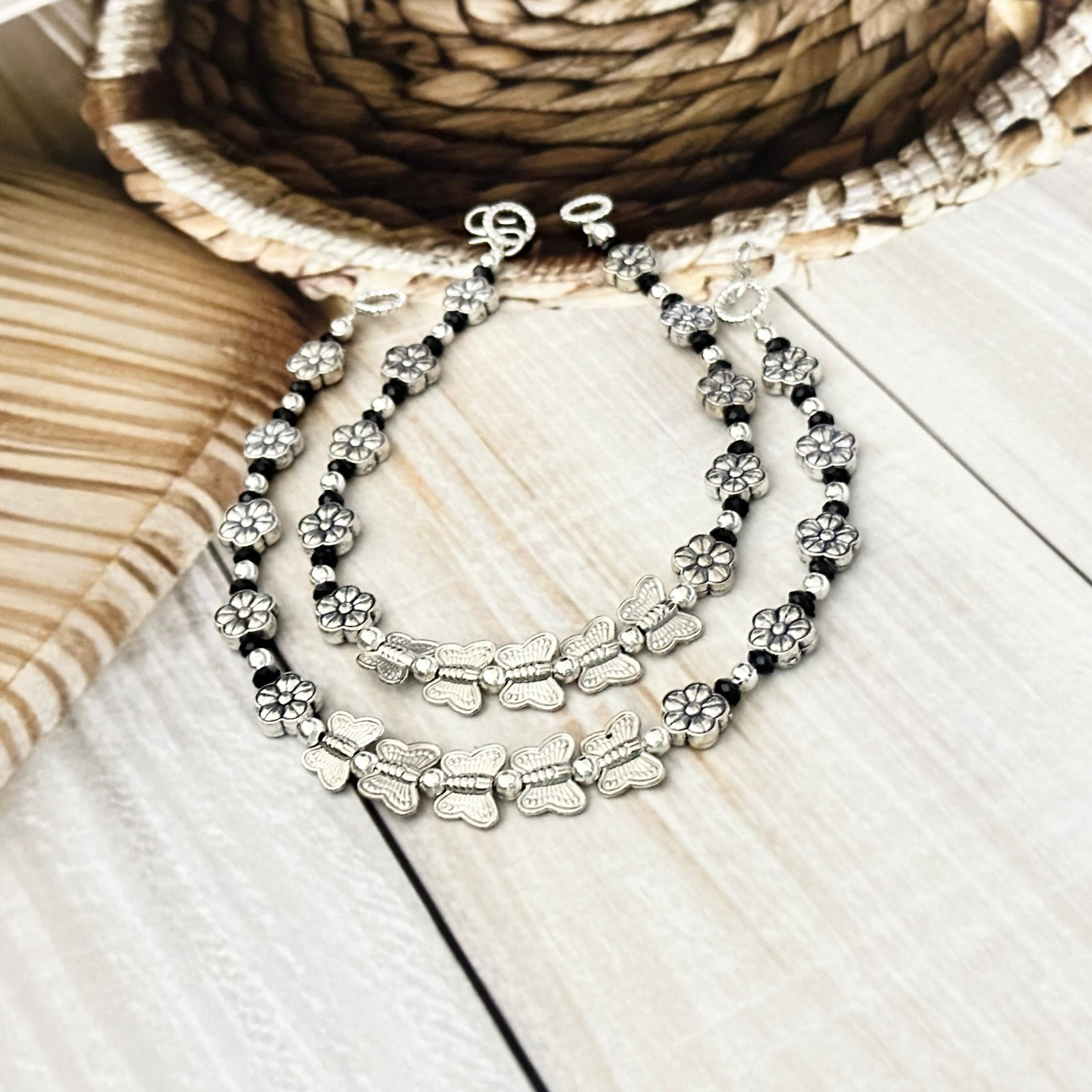 Charming Designer Black Bead Anklets with Silver Flower and Butterfly Motifs Footwear Accessory
