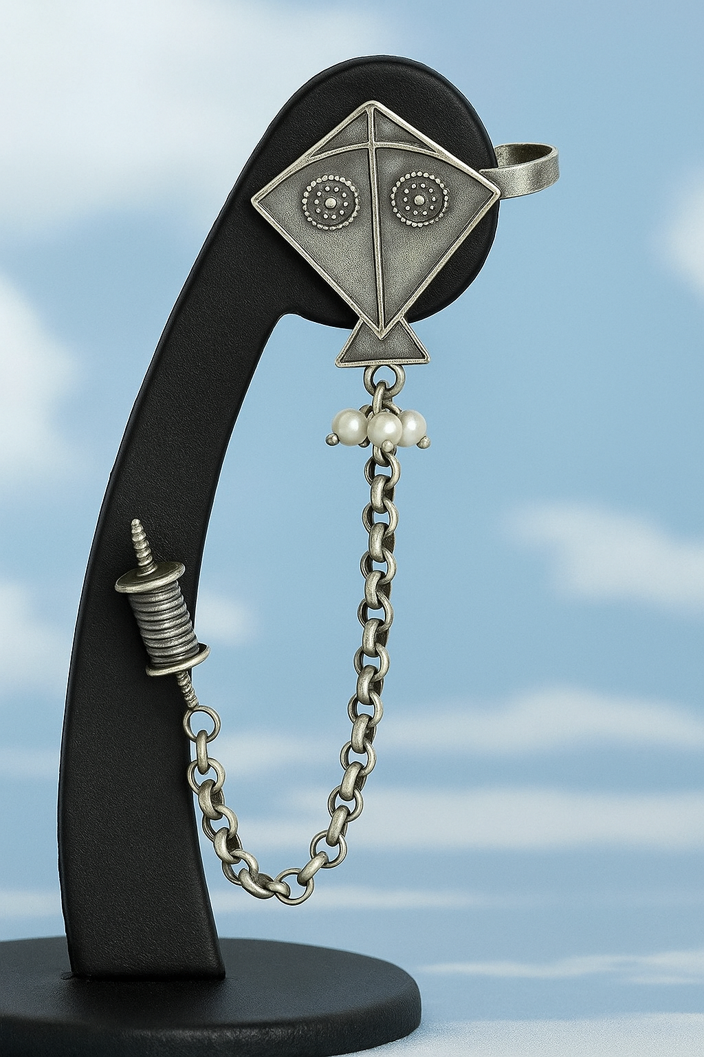 Intricately Designed Silver Kite Cuff with Delicate Chain Links and Decorative Bells