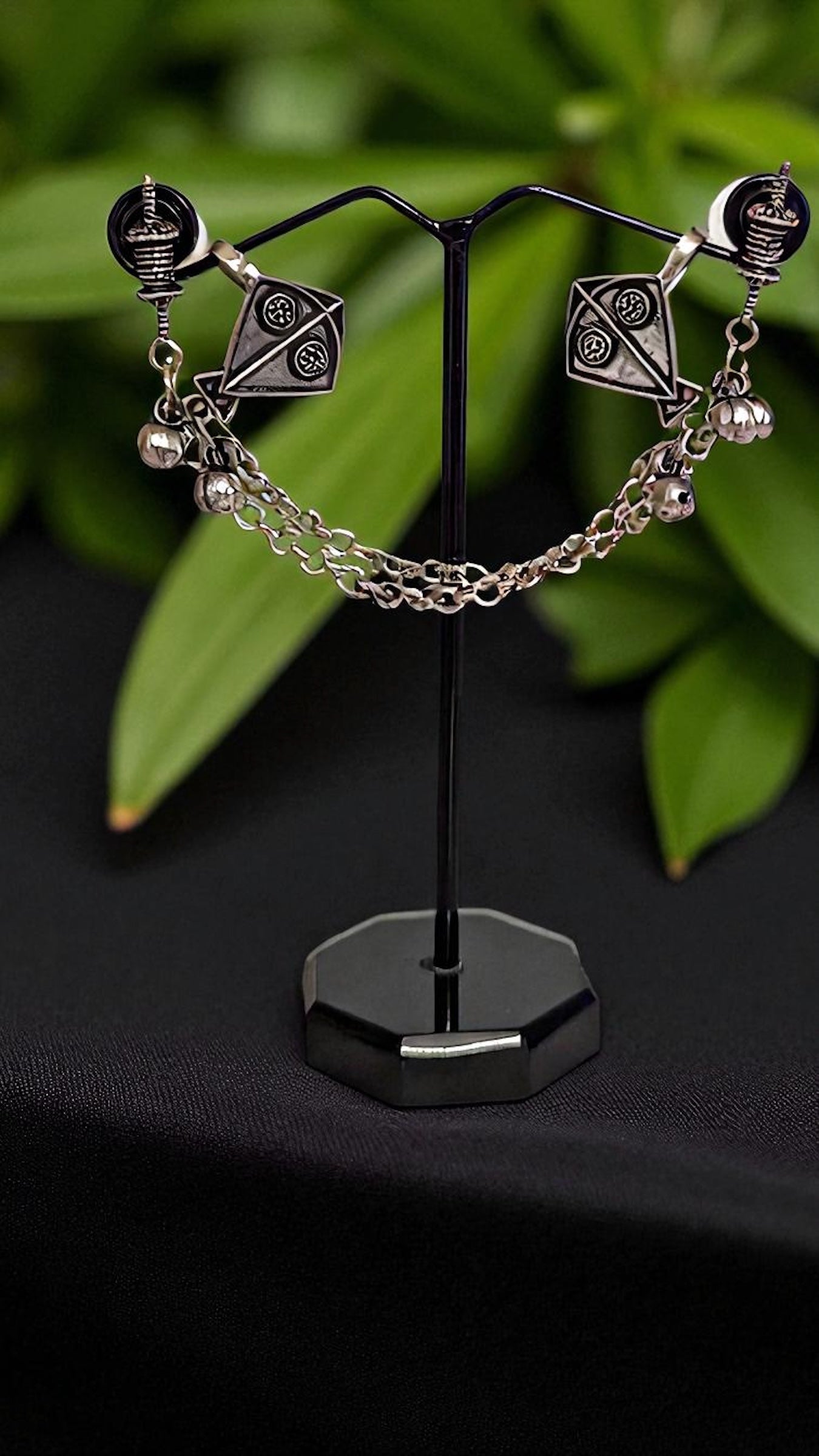 Intricately Designed Silver Kite Cuff with Delicate Chain Links and Decorative Bells